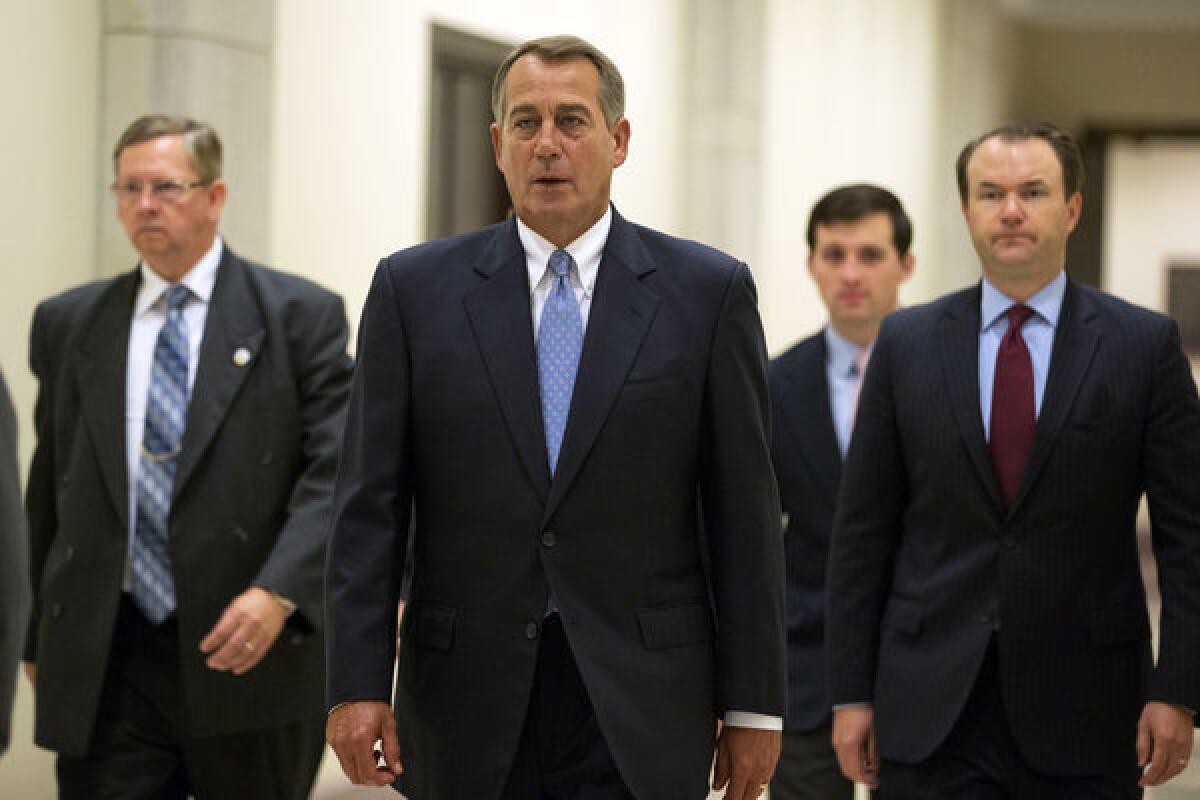 House Speaker John A. Boehner (R-Ohio) heads to a news conference on Capitol Hill in Washington.