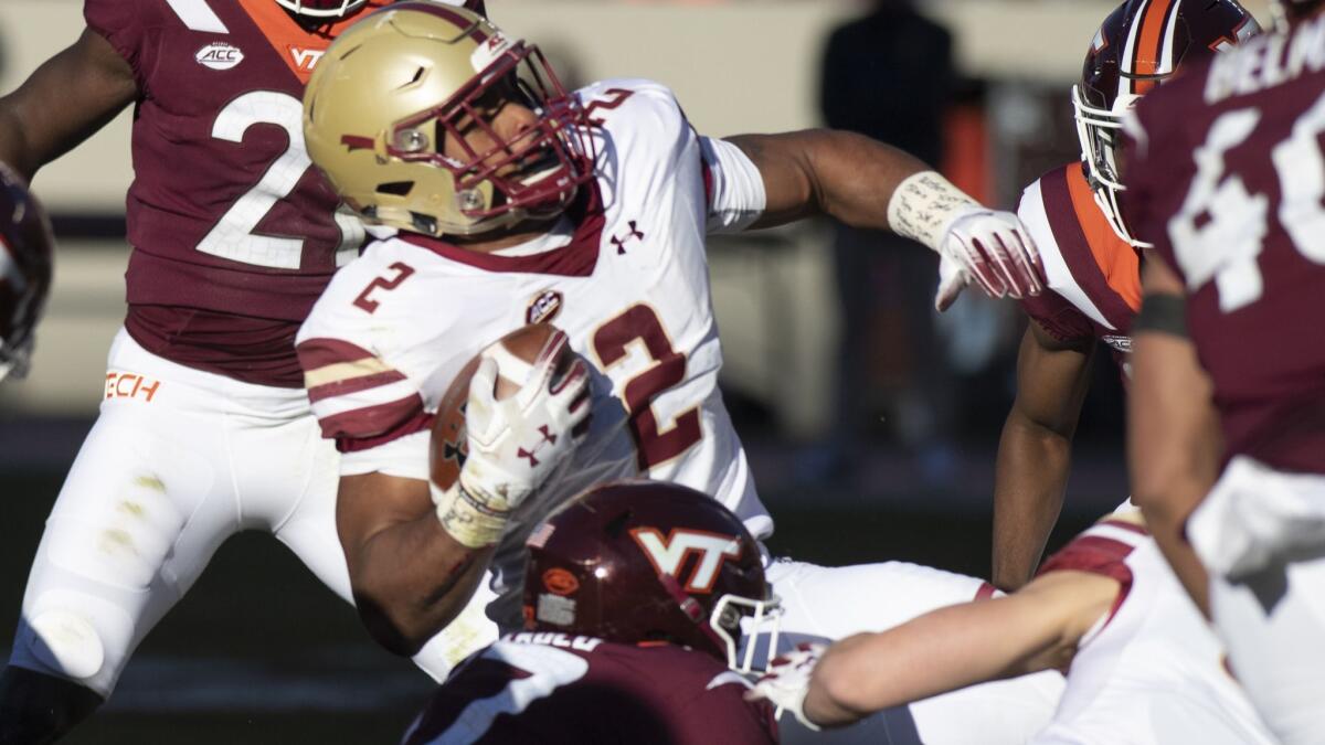 Boston College running back AJ Dillion is brought down during the first half against Virginia Tech on Saturday.