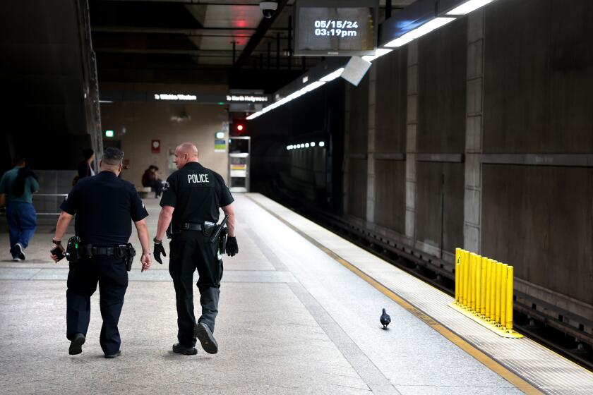 LOS ANGELES, CALIFORNIA May 15, 2024-Police officers patrol the Metro Red Line in Los Angeles Wednesday. (Wally Skalij/Los Angeles Times)