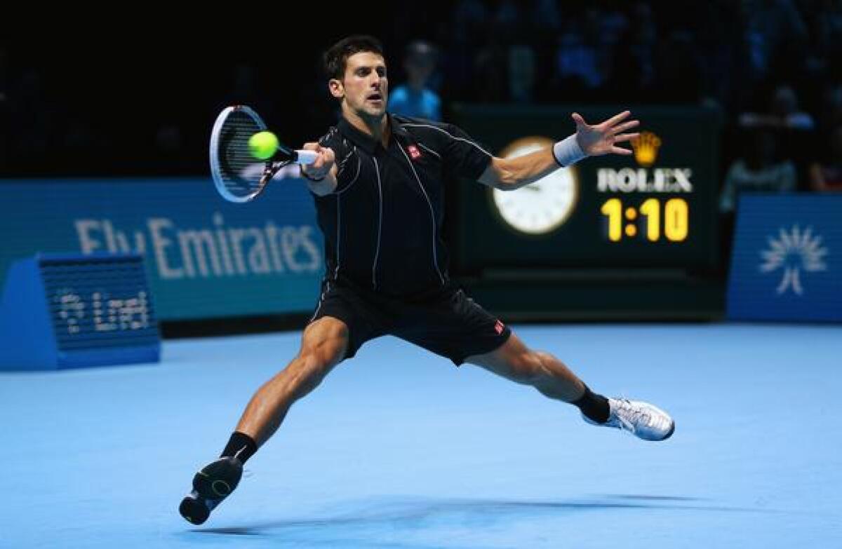 Novak Djokovic returns a shot during his victory over Rafael Nadal at the ATP World Tour finals in London on Monday.