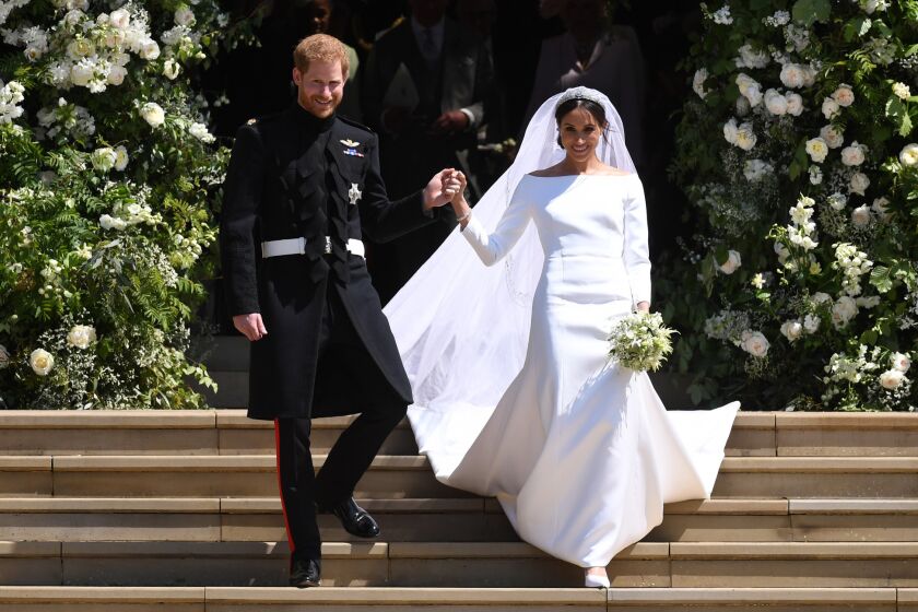 Mandatory Credit: Photo by NEIL HALL/POOL/EPA-EFE/REX/Shutterstock (9684230lz) Meghan Markle and Prince Harry Royal Wedding of Prince Harry and Meghan Markle in Windsor, United Kingdom - 19 May 2018 Britain's Prince Harry (L), Duke of Sussex and Meghan (R), Duchess of Sussex exit St George's Chapel in Windsor Castle after their royal wedding ceremony, in Windsor, Britain, 19 May 2018. The couple have been bestowed the royal titles of Duke and Duchess of Sussex on them by the British monarch. ** Usable by LA, CT and MoD ONLY **