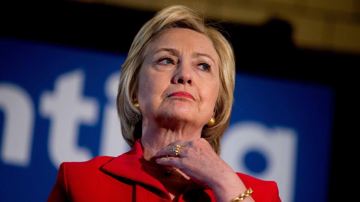 Democratic presidential candidate Hillary Clinton waits to speak at an event in Bowling Green, Ky. in May.