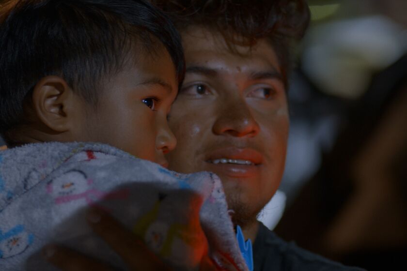 Luis Diaz, right, with Noah in a scene from “Living Undocumented.” Credit: Netflix