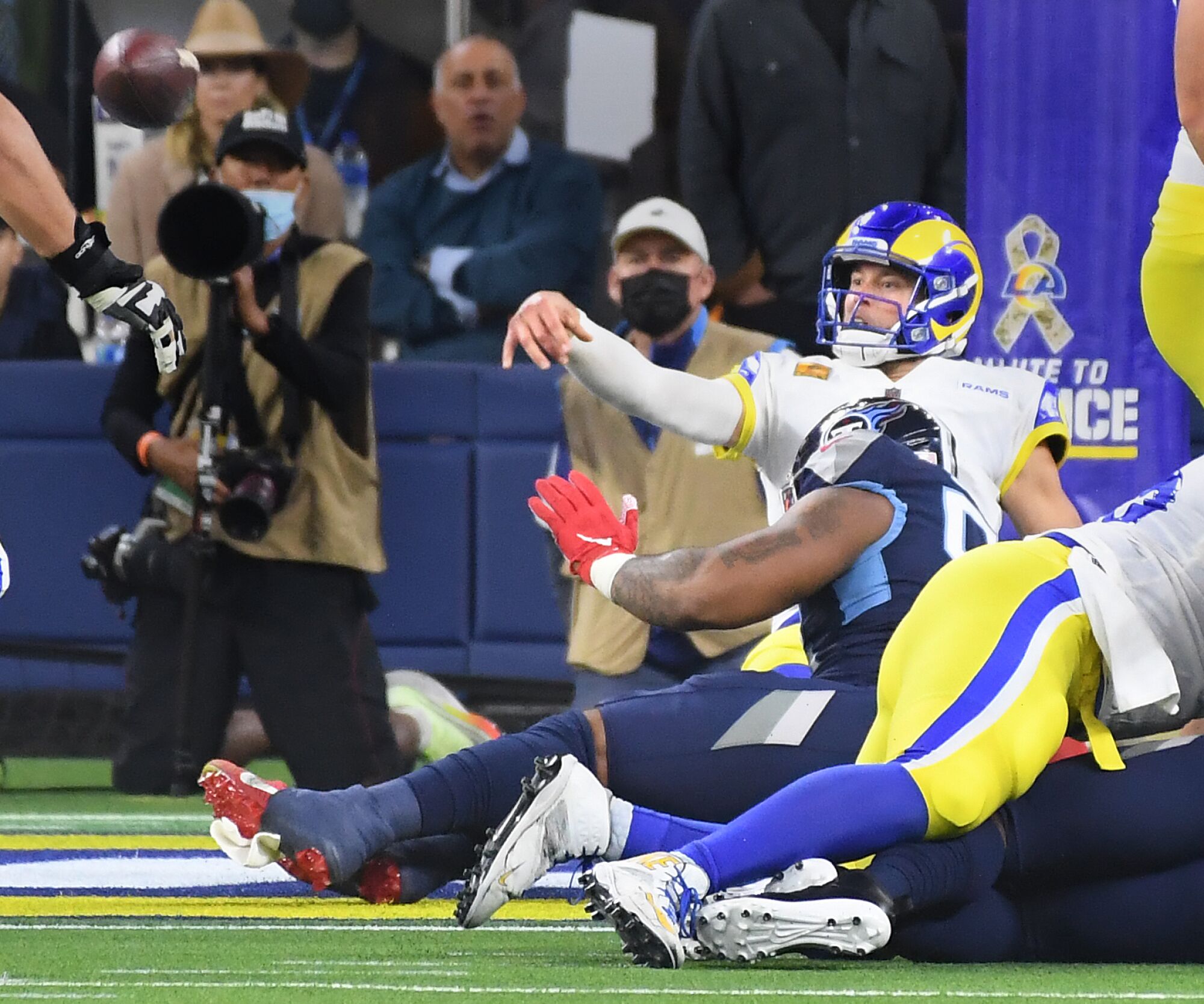 Rams quarterback Matthew Stafford throws an interception just before he's tackled in the end zone.