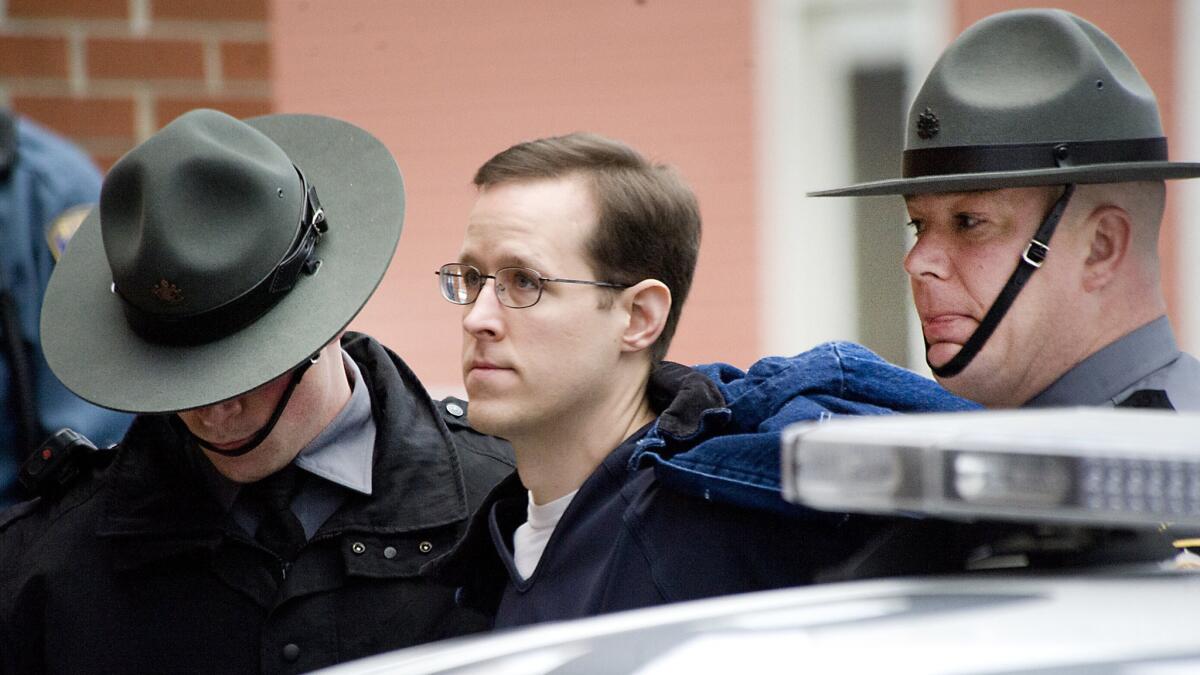 Eric Frein is escorted to a preliminary hearing on Jan. 5 at the Pike County Courthouse in Milford, Pa.