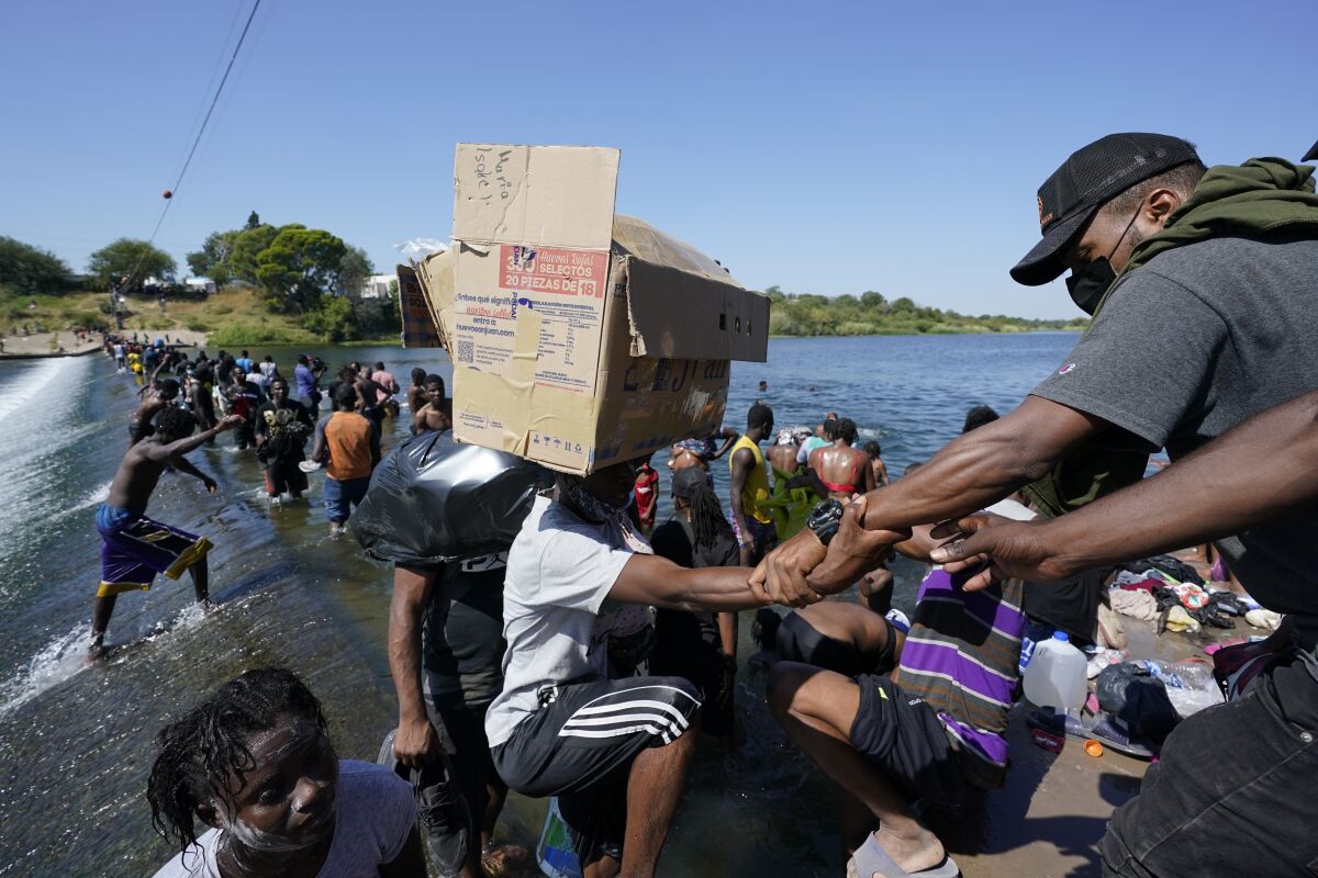 Haitian migrants use a dam to cross to and from the United States from Mexico.