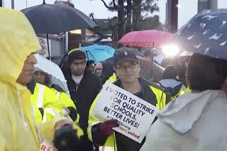 A three-day strike by Los Angeles public school employees kicked off early Tuesday, with picketers marching through the rain