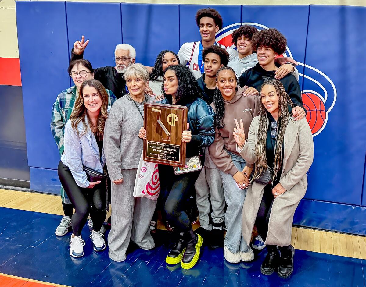 The Arenas family gathers around Alijah Arenas.