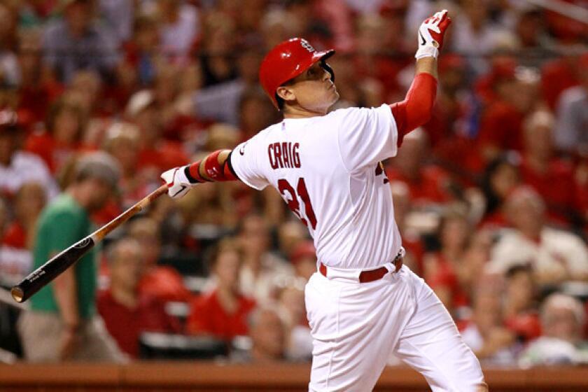 Cardinals first baseman Allen Craig hits a grand slam against the Cincinnati Reds during a regular-season game.