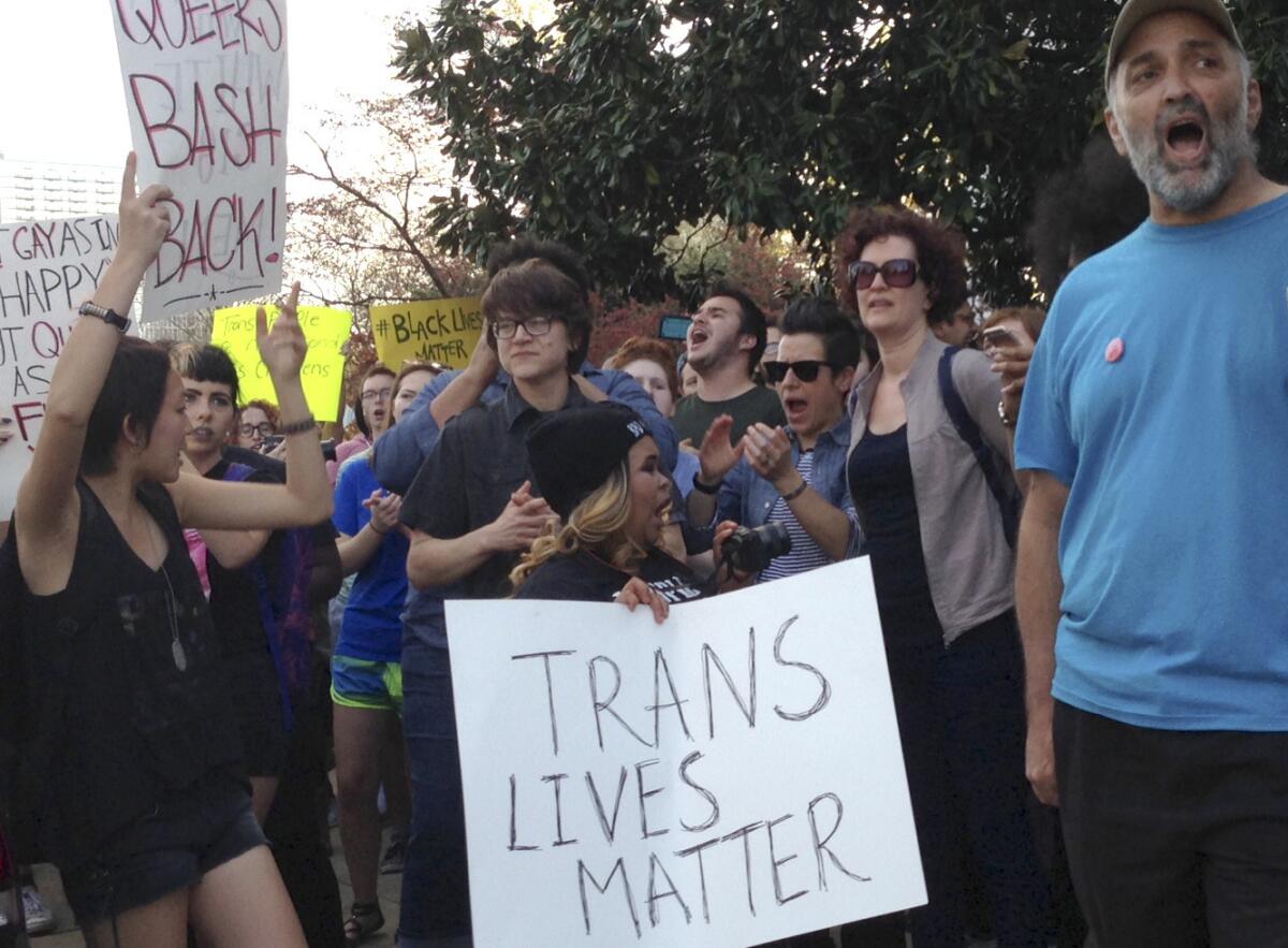 After North Carolina lawmakers approved controversial anti-discrimination rules, people protest outside the Executive Mansion in Raleigh on March 24.