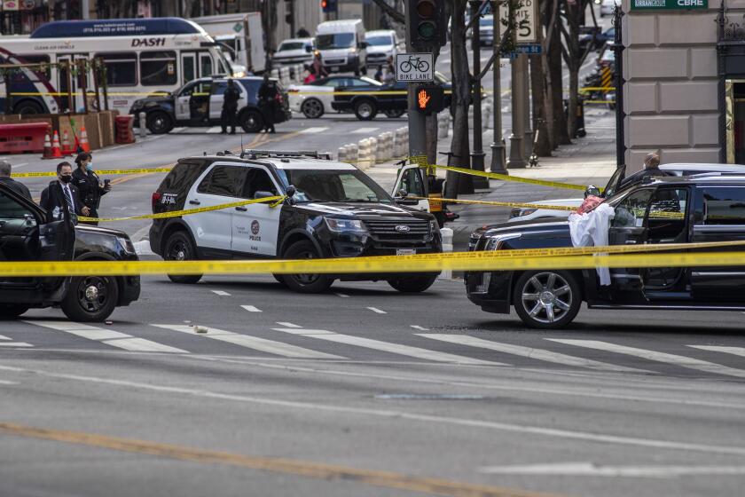LOS ANGELES, CA - APRIL 27: LAPD investigates scene of shooting at 7th and Figueroa Streets where an Uber driver was shot and killed on Tuesday, April 27, 2021 in downtown Los Angeles, CA. (Brian van der Brug / Los Angeles Times)