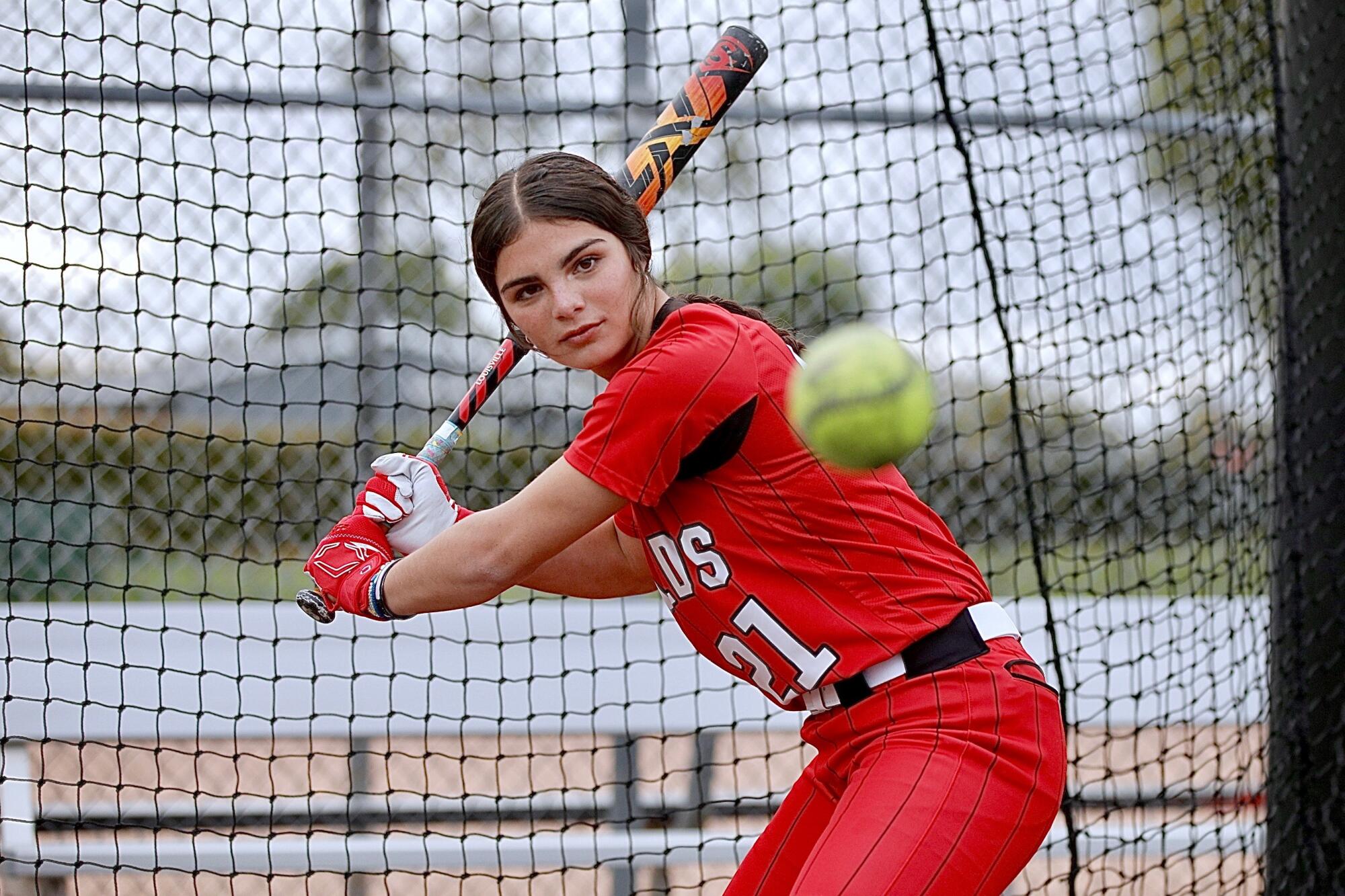 Whittier Christian senior Aleena Garcia works in the batting cage.