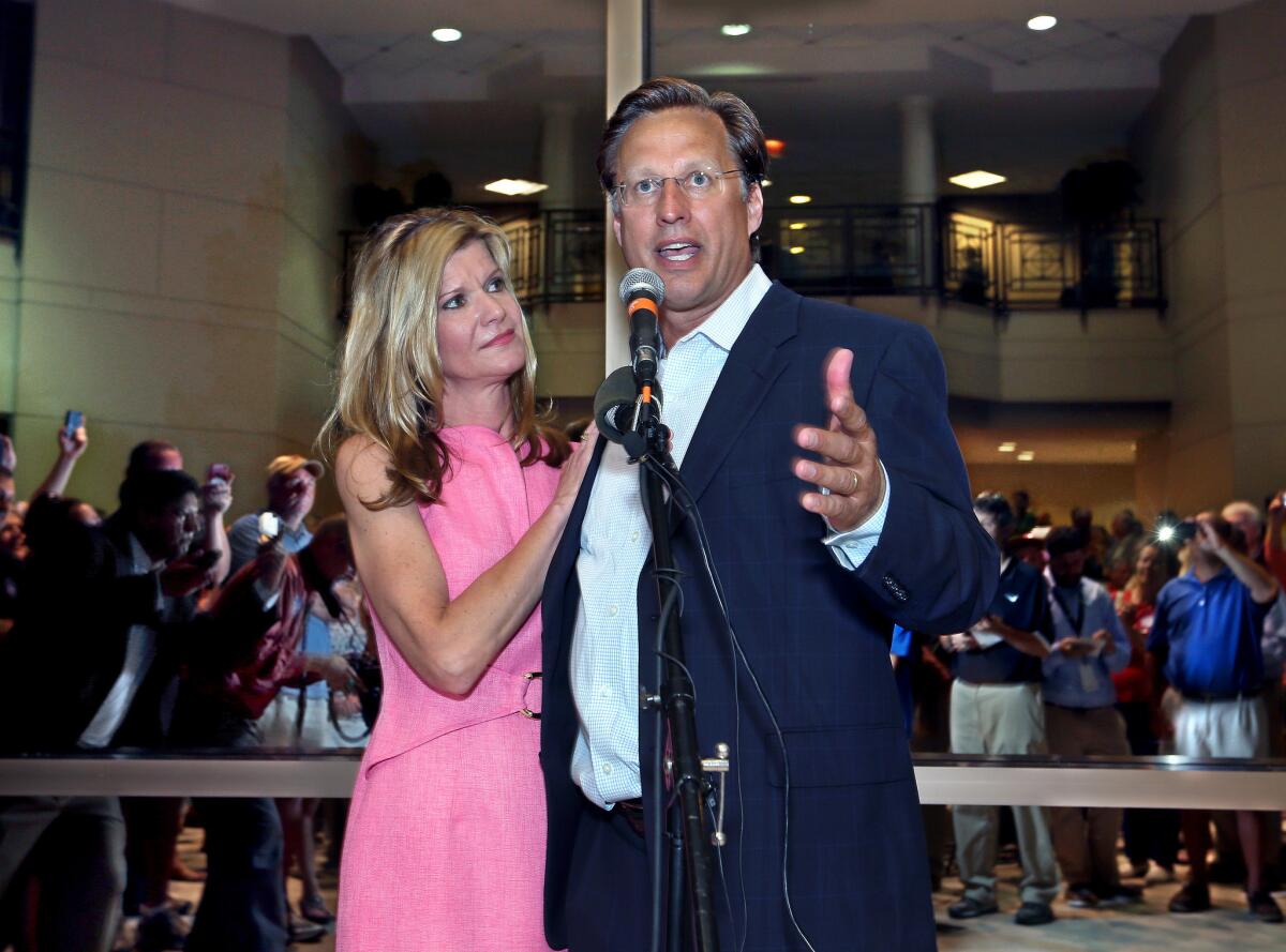 Dave Brat stands his wife, Laura, as he speaks to supporters in Henrico, Va., after defeating Republican Congressman Eric Cantor in the Republican primary for the 7th Congressional District in Virginia on Tuesday.