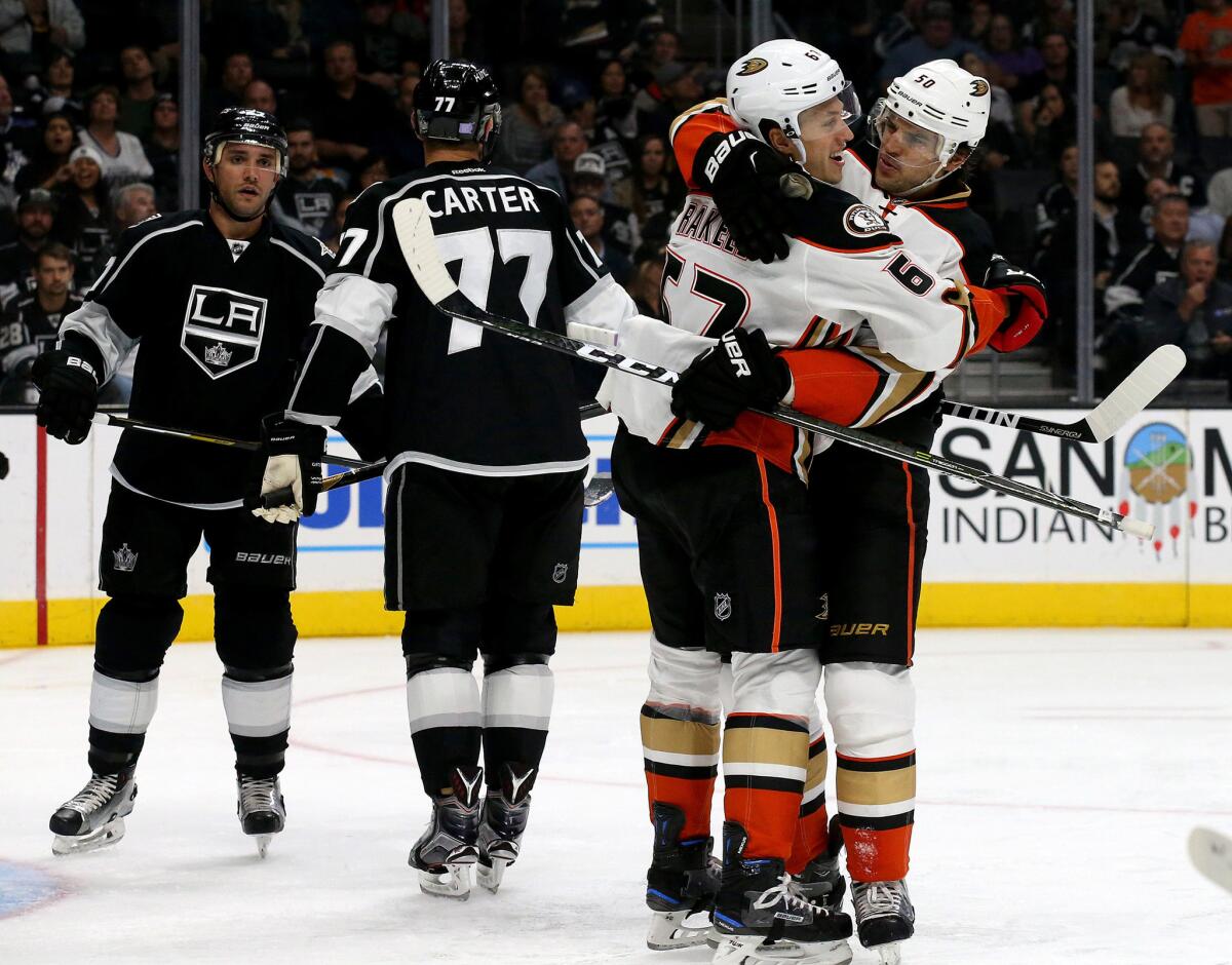 Ducks center Rickard Rakell, left, celebrates with teammate Antonie Vermette after Vermette scored a goal against the Kings in the second period.