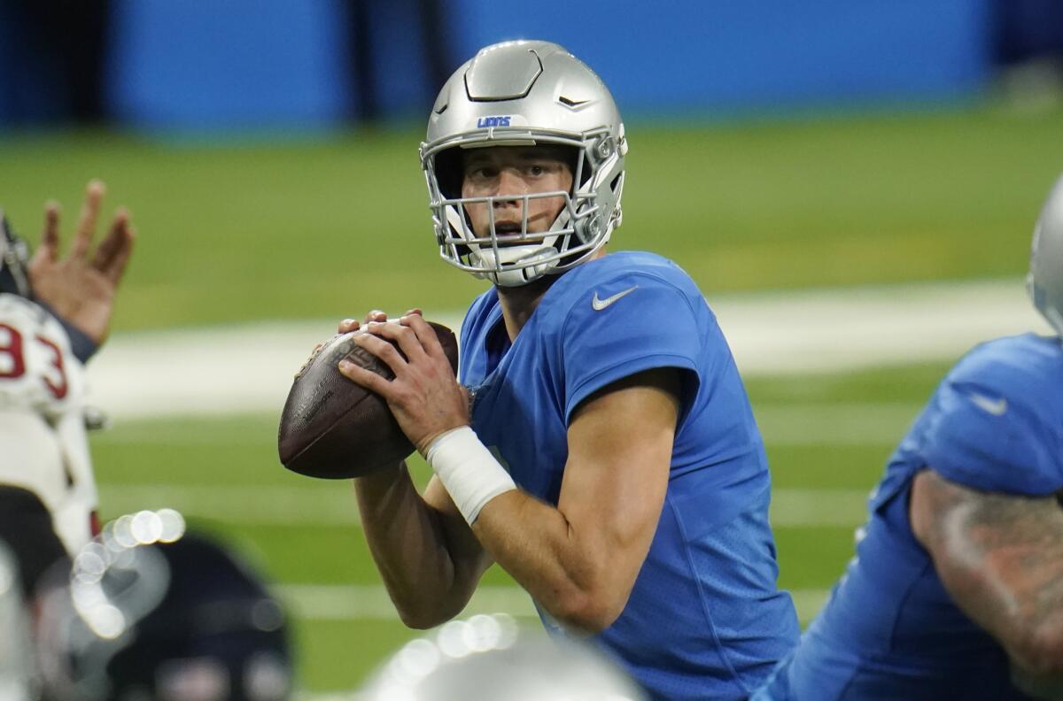 Detroit Lions quarterback Matthew Stafford looks downfield during the second half of an NFL football game.