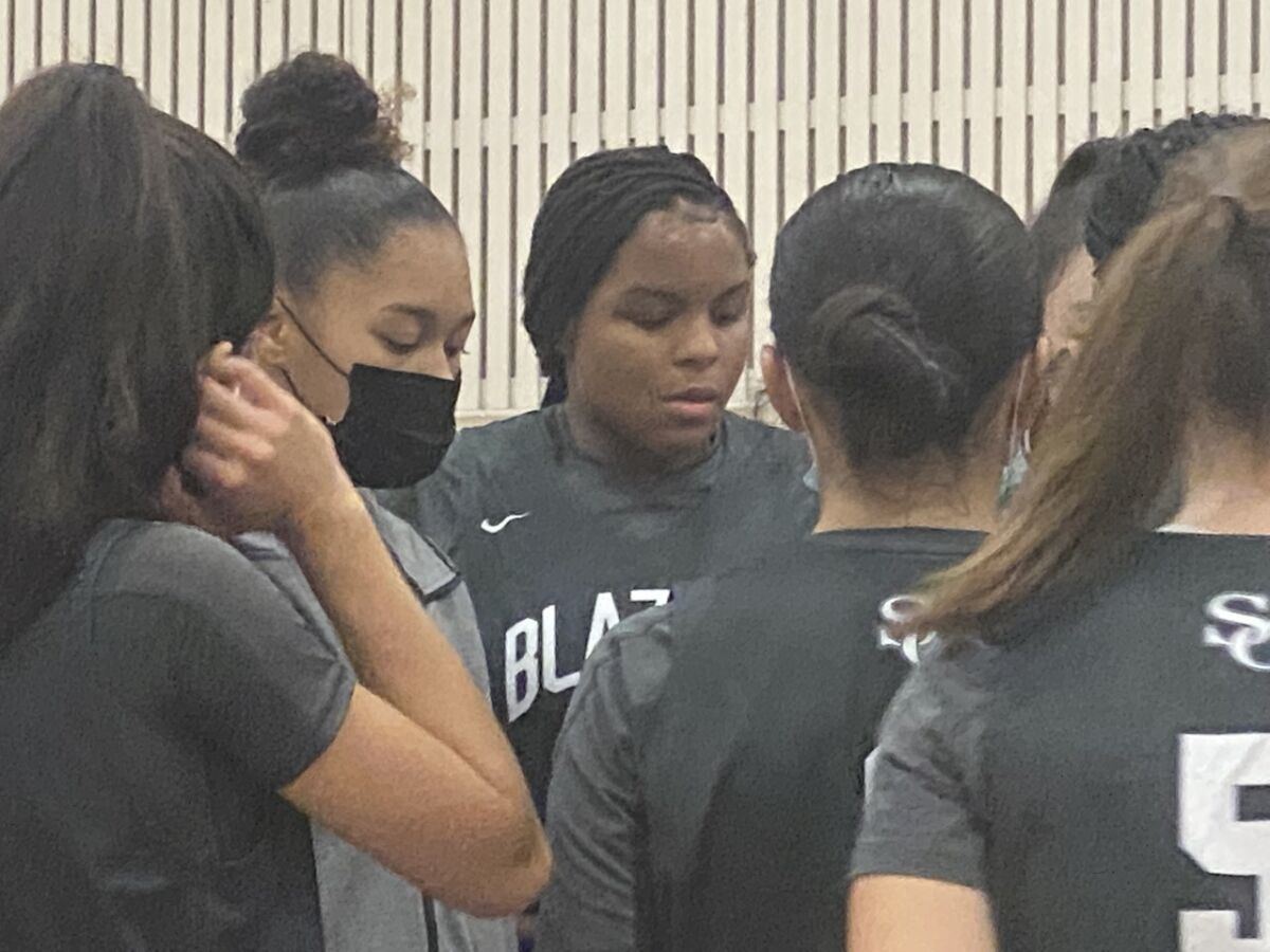 MacKenly Randolph is focused for Sierra Canyon in huddle during league opener.