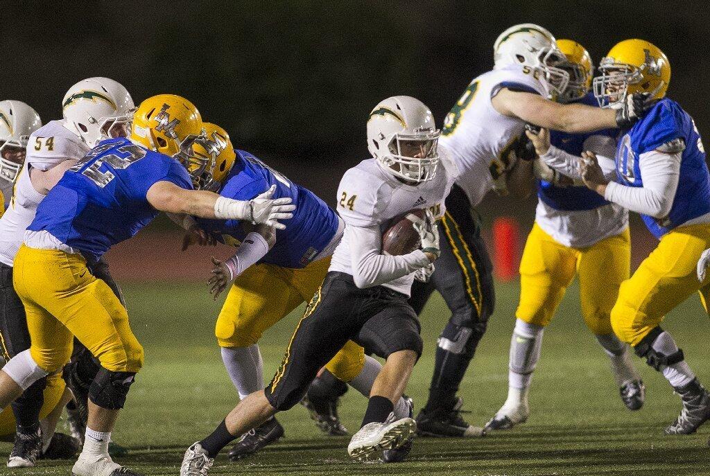 Edison's Jack Carmichael cuts upfield to avoid a tackle during the CIF Southern Section Division 3 championship game at La Mirada High School on Friday.