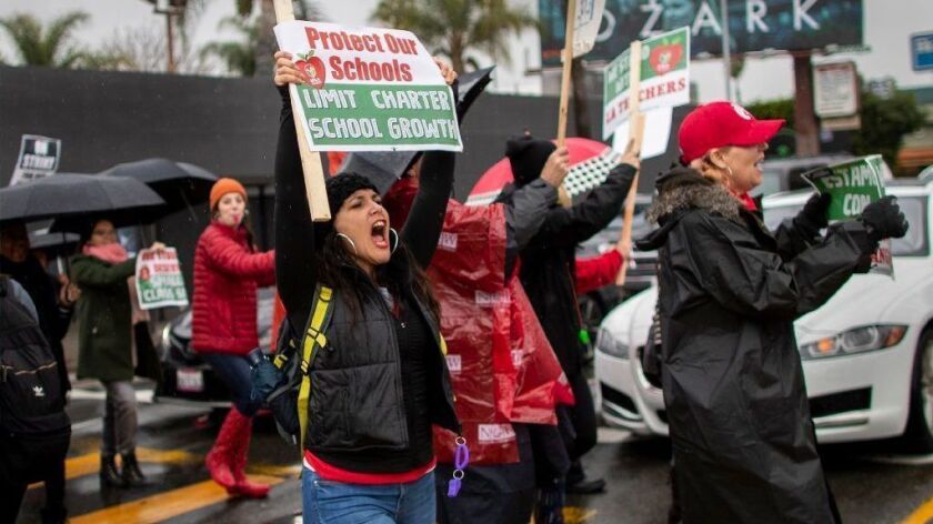 Parents, teachers and students picket outside Hollywood High School during the second day of the LAUSD teachers' strike on Jan. 15.