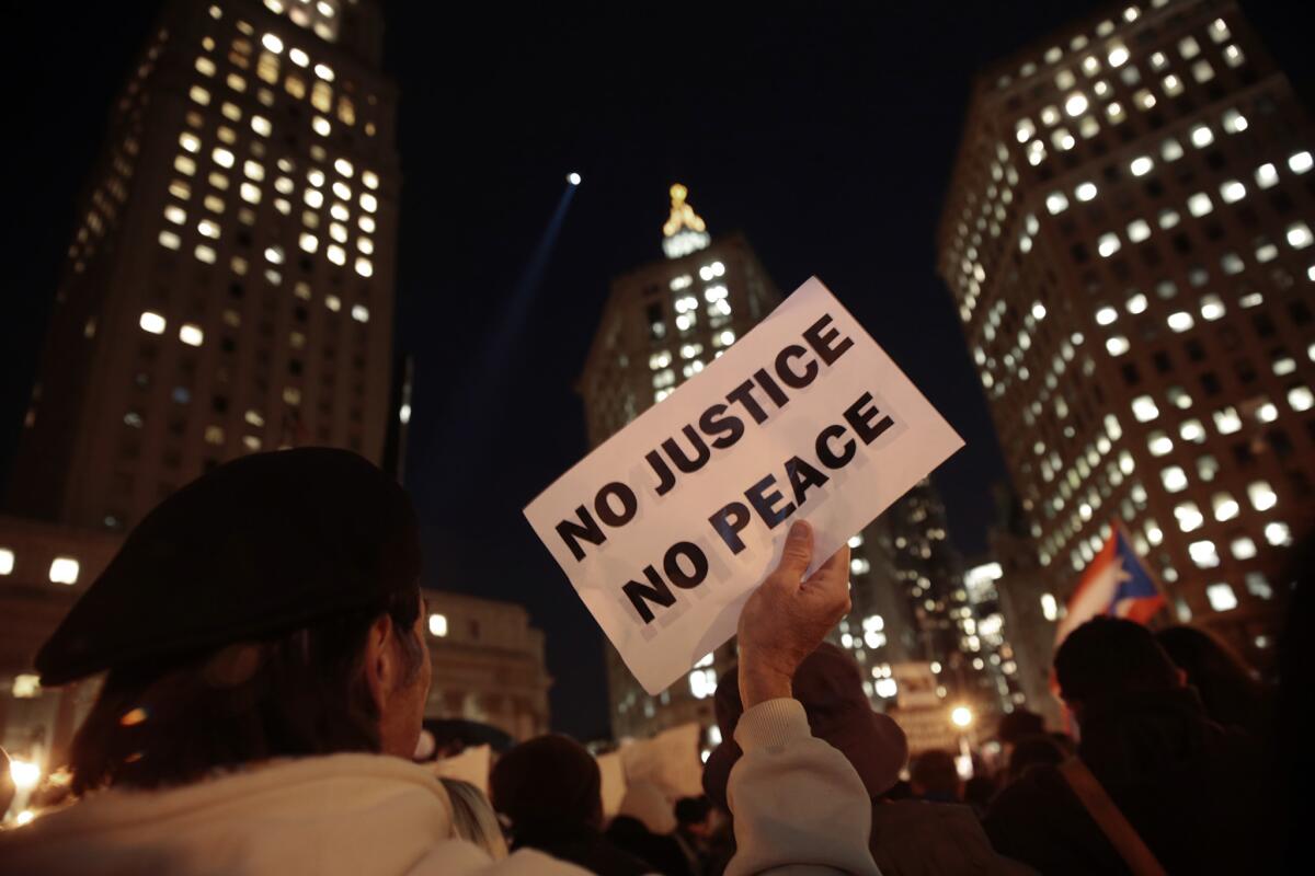 Protesters gather in New York over a grand jury's decision not to indict a police officer in the death of Eric Garner in Staten Island. Video showed the officer putting Garner, who had been selling loose cigarettes, in an apparent choke hold, a move banned by the city's police department.