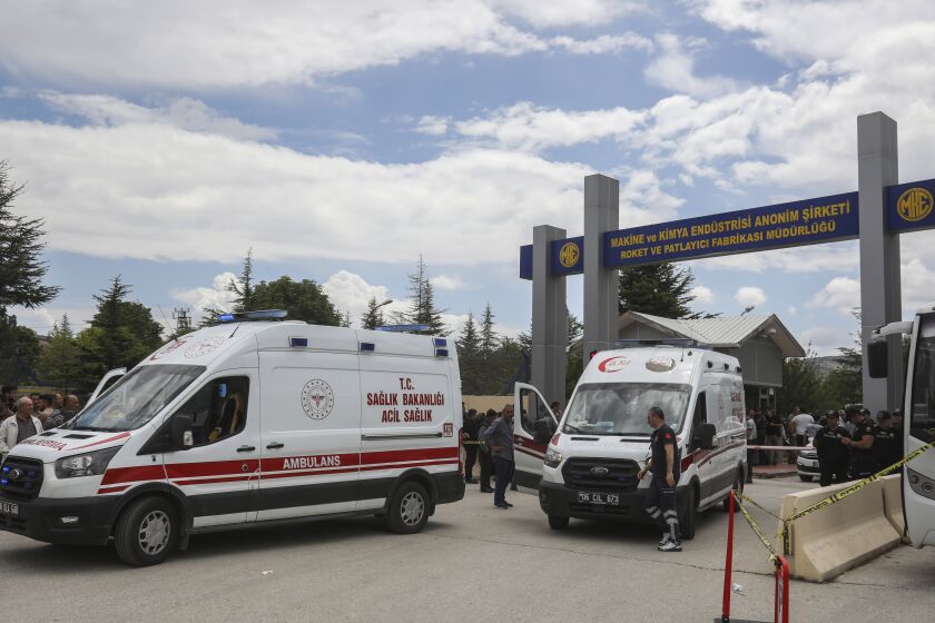 Ambulances park outside a compound of the state-owned Mechanical and Chemical Industry Corporation on the outskirts of Ankara, Turkey, Saturday, June 10, 2023. An official says an explosion at a rocket and explosives plant in Turkey caused a building to collapse, killing all five workers inside. The explosion occurred at around 8:45 a.m. Saturday at the compound of the state-owned Mechanical and Chemical Industry Corporation, on the outskirts of the capital, Ankara. (Yavuz Ozden/DIA Images via AP)