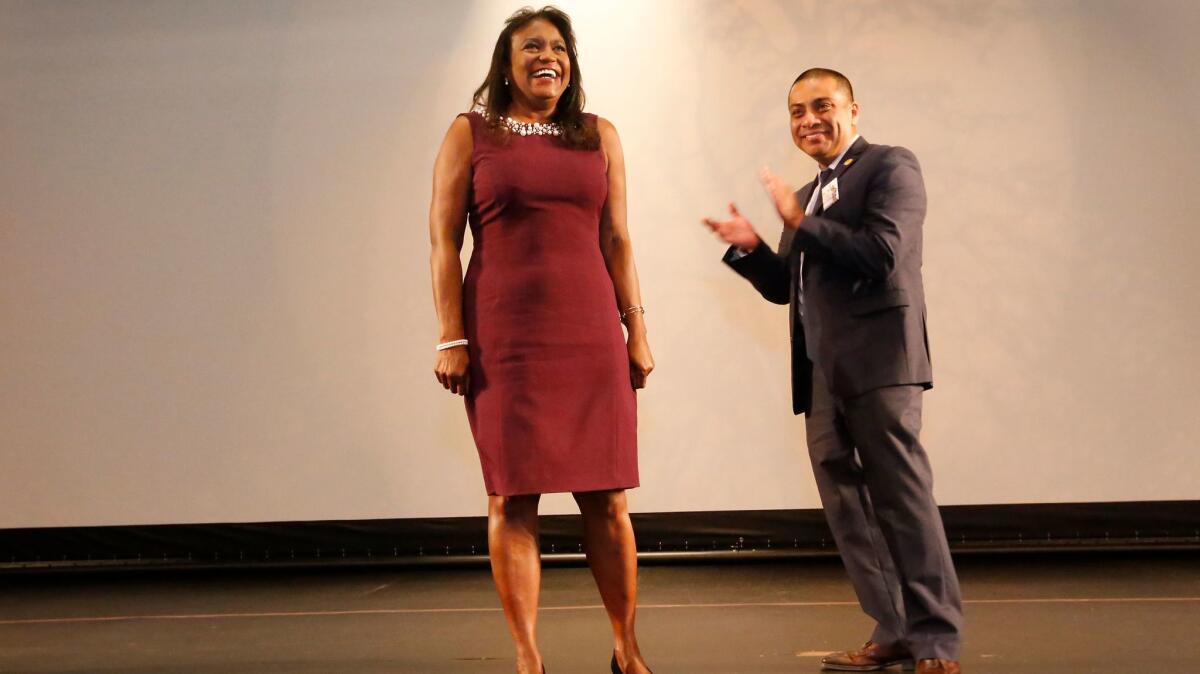Supt. Michelle King is applauded by then-school board president Ref Rodriguez in August at the annual superintendent's address. Soon after, King went on medical leave and Rodriguez resigned as president in the face of alleged campaign violations. Rodriguez remains on the board.
