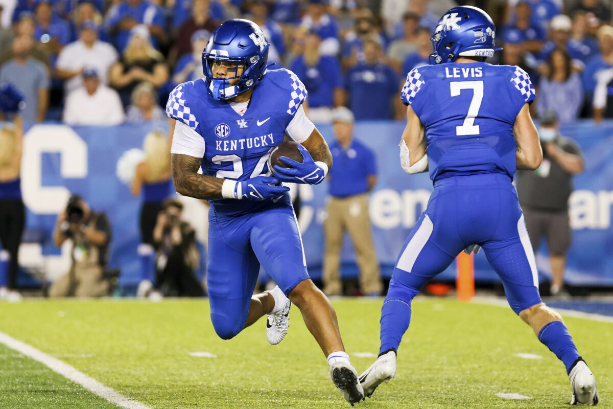 Kentucky running back Chris Rodriguez Jr. (24) carries the ball during the second half of the team's NCAA college football game against Missouri in Lexington, Ky., Saturday, Sept. 11, 2021. (AP Photo/Michael Clubb)