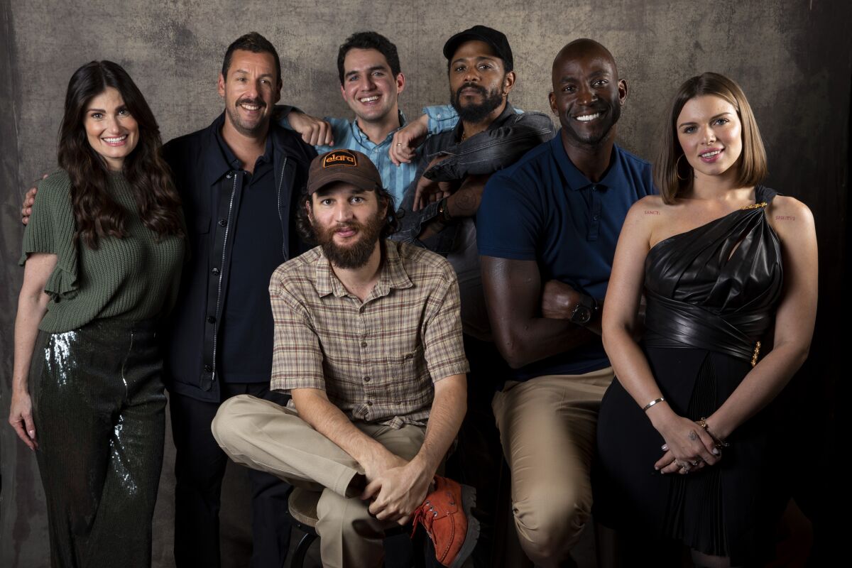 Actors Idina Menzel and Adam Sandler, directors Benjamin Safdie and Joshua Safdie and actors Lakeith Stanfield, Kevin Garnett and Julia Fox, from the film "Uncut Gems," photographed in the L.A. Times Photo Studio at the Toronto International Film Festival on Sept. 9.