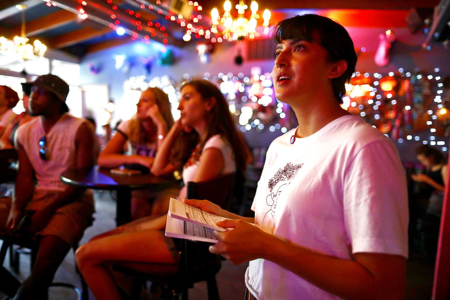 Immigration rights activist Angel Ulloa watches the debate broadcast at a viewing party in El Paso. Ulloa is the local coordinator of the Latino progressive organization Jolt, which hosted the watch party in a bar near the U.S.-Mexico border.