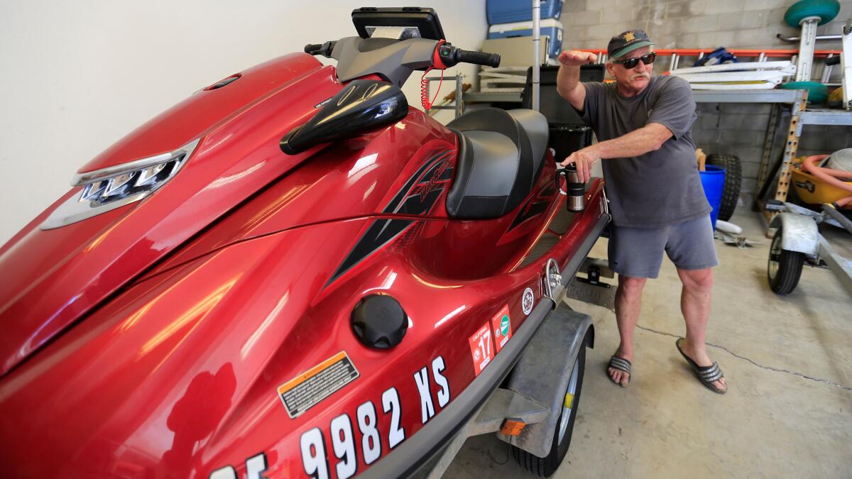 Bob Guza and his research team use GPS equipment mounted on a sand buggy and jet ski, above, to seasonally map beach levels and the impact of tides and storms.