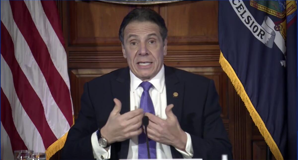 New York Gov. Andrew Cuomo gestures as he speaks 