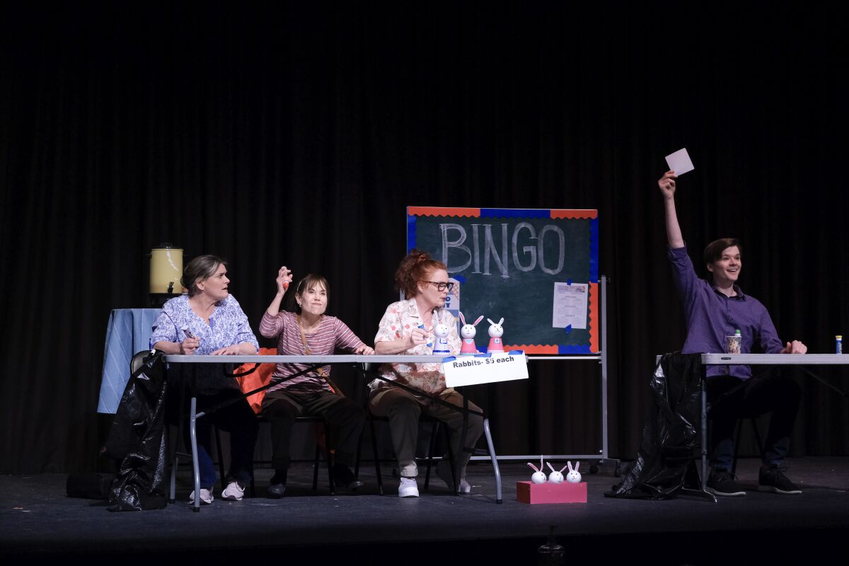 Four people playing bingo in a stage play.