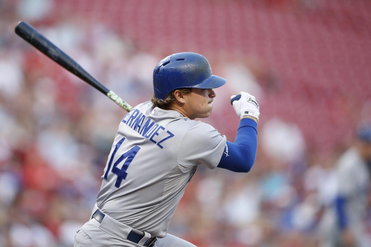 Enrique Hernandez drives in a run against Cincinnati on Aug. 26.