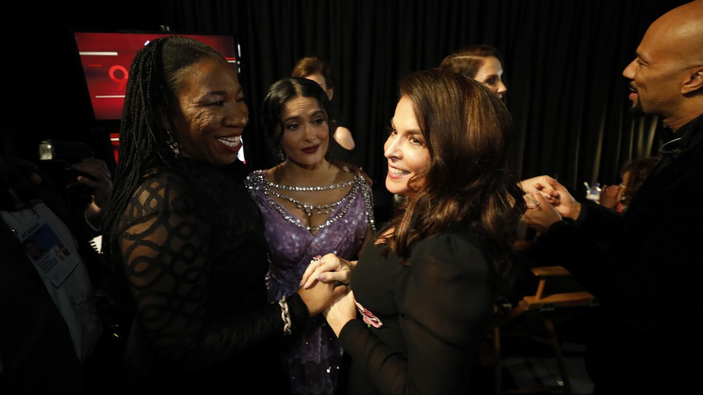 Activist Tarana Burke, Salma Hayek and Annabella Sciorra backstage at the 90th Academy Awards on Sunday at the Dolby Theatre in Hollywood.