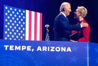 Cindy McCain, wife of late Sen. John McCain, greets President Joe Biden as he arrives to deliver remarks on democracy and honoring the legacy of McCain at the Tempe Center for the Arts, Thursday, Sept. 28, 2023, in Tempe, Ariz. (AP Photo/Evan Vucci)