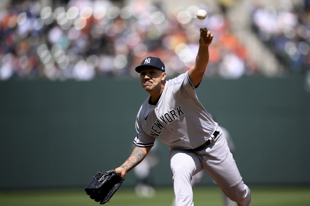 New York Yankees starting pitcher Nestor Cortes (65) delivers a pitch during the first inning of a baseball game against the Baltimore Orioles, Sunday, April 17, 2022, in Baltimore. (AP Photo/Nick Wass)