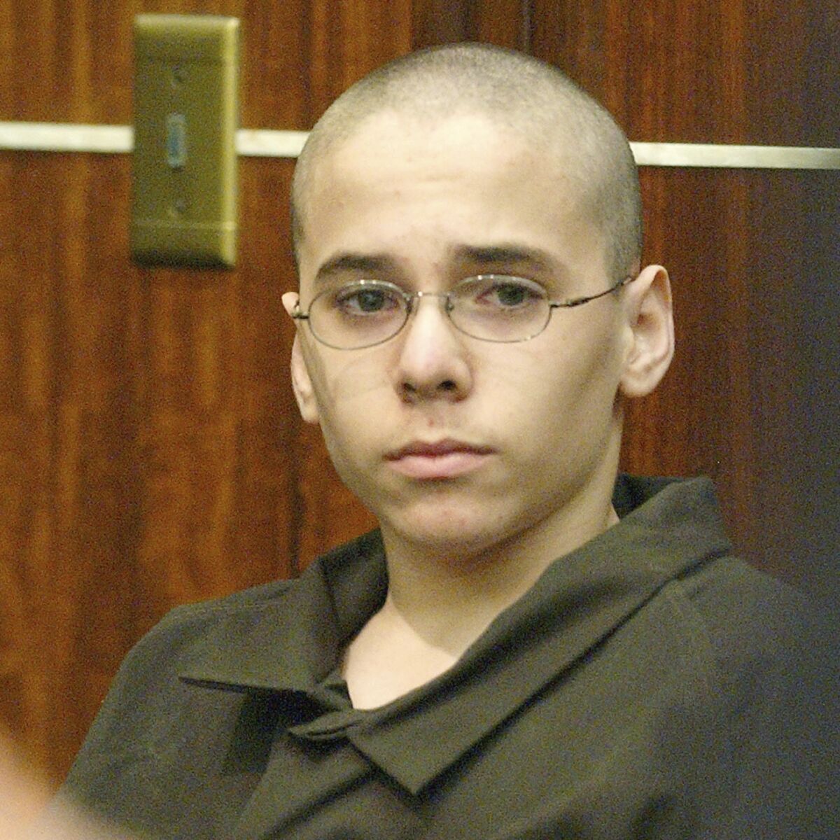 FILE - In this Monday, March 22, 2004 file photo, Michael Hernandez listens to his lawyer at the Miami-Dade County Courthouse in Miami. According to Florida Department of Corrections online records, Hernandez, who lured Jaime Gough into a bathroom stall at their suburban Miami middle school when he was 14, cut his throat and died in prison on Thursday, April 29, 2021. (AP Photo/Alan Diaz)
