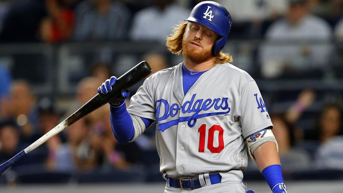 Dodgers third baseman Justin Turner heads back to the dugout after striking out against the New York Yankees in the third inning.