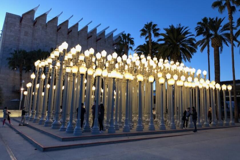 The Los Angeles County Museum of Art's "Urban Light" installation provided some levity and a creative outlet amid the coronavirus outbreak Tuesday evening.