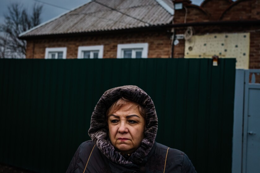 NEW YORK, UKRAINE -- FEBRUARY 22, 2022: Irina Federovna, 60, a pensioner, outside her home in New York, Ukraine, Tuesday, Feb. 22, 2022. (MARCUS YAM / LOS ANGELES TIMES)