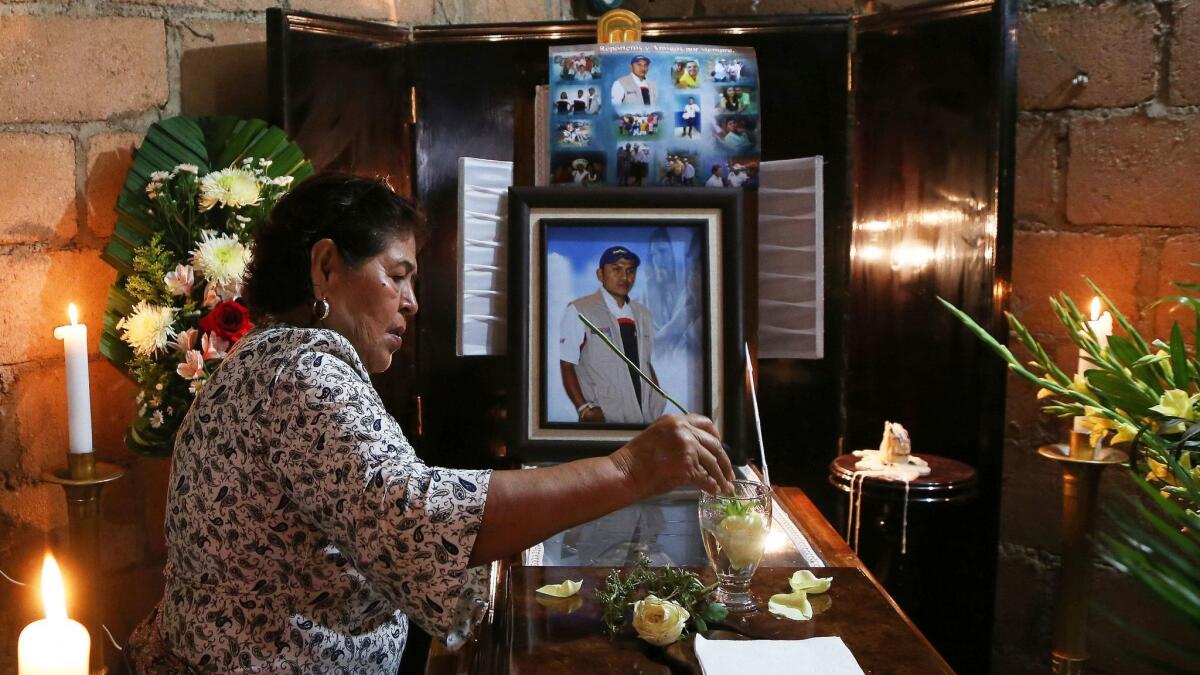 A woman mourns at the coffin of slain journalist Gumaro Perez during his wake inside his mother's home in Acayucan, Veracruz state, Mexico, on Wednesday.