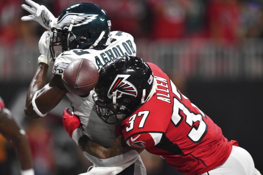 Philadelphia Eagles wide receiver Nelson Agholor (13) is hit by Atlanta Falcons free safety Ricardo Allen (37) during the first half of an NFL football game, Sunday, Sept. 15, 2019, in Atlanta. (AP Photo/John Amis)