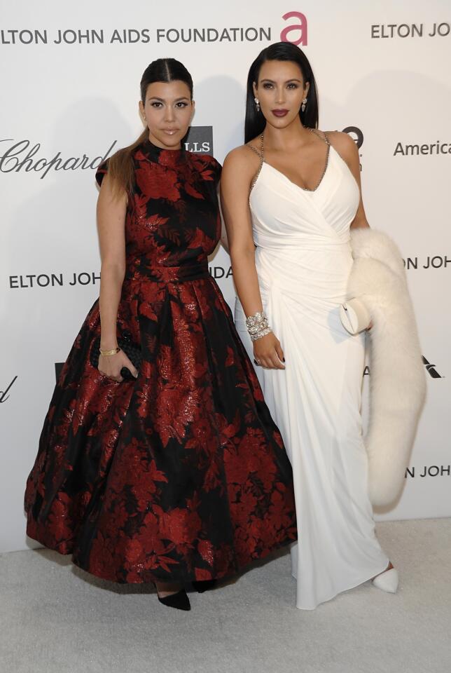 Television personality Kim Kardashian, right, and television personality Kourtney Kardashian.