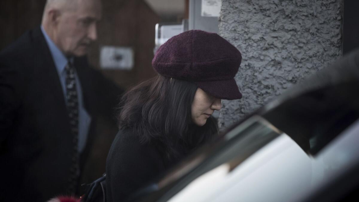 Huawei Chief Financial Officer Meng Wanzhou, who is out on bail and remains under partial house arrest after she was detained Dec. 1 at the behest of American authorities, leaves her home to attend a court appearance regarding her bail conditions, in Vancouver, Canada.