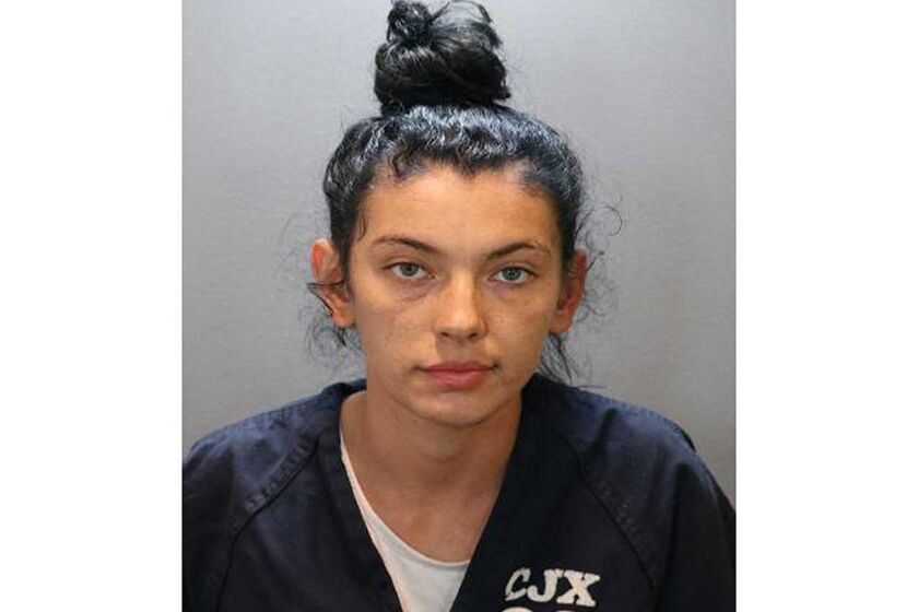 Booking photo of Hannah Star Esser, 20, has been charged with murder after running over a man she believed had tried to run over a cat in Cypress.