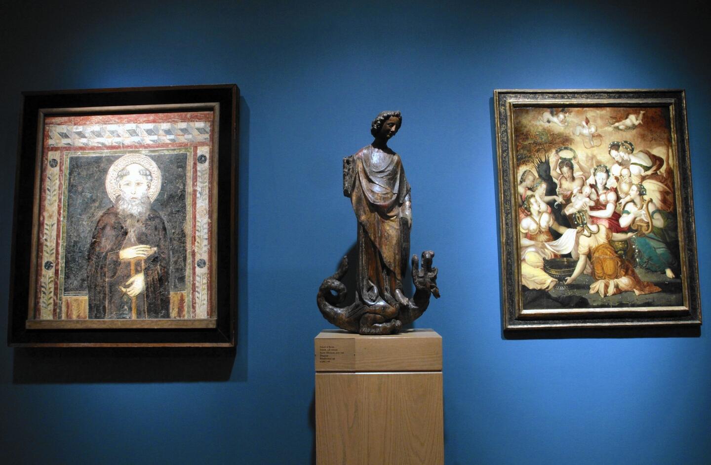 In 1964, Norton Simon purchased the entire inventory of the Duveen Brothers gallery in New York. Among the holdings was a 14th century fresco of St. Anthony, from left, the 13th/14th century "St. Michael and the Dragon as Virtue Overcoming Vice" and the 16th century "The Birth of Adonis." They are shown in "Lock, Stock and Barrel," focusing on the purchase, at the Norton Simon Museum in Pasadena.