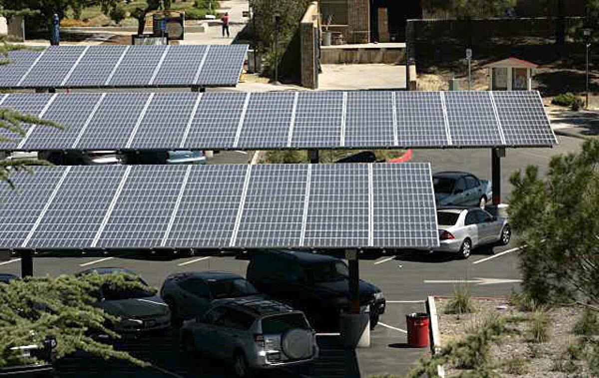 These solar panels at Pierce College in Woodland Hills are among the district's green energy projects that were built. But millions of dollars were poured into designs for installations that proved so impractical or unpopular that they were scrapped.