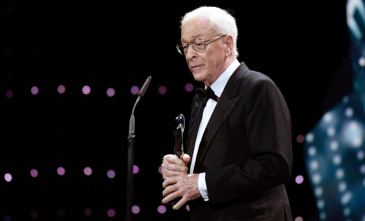 Michael Caine accepts an award Saturday at the European Film Awards in Berlin.