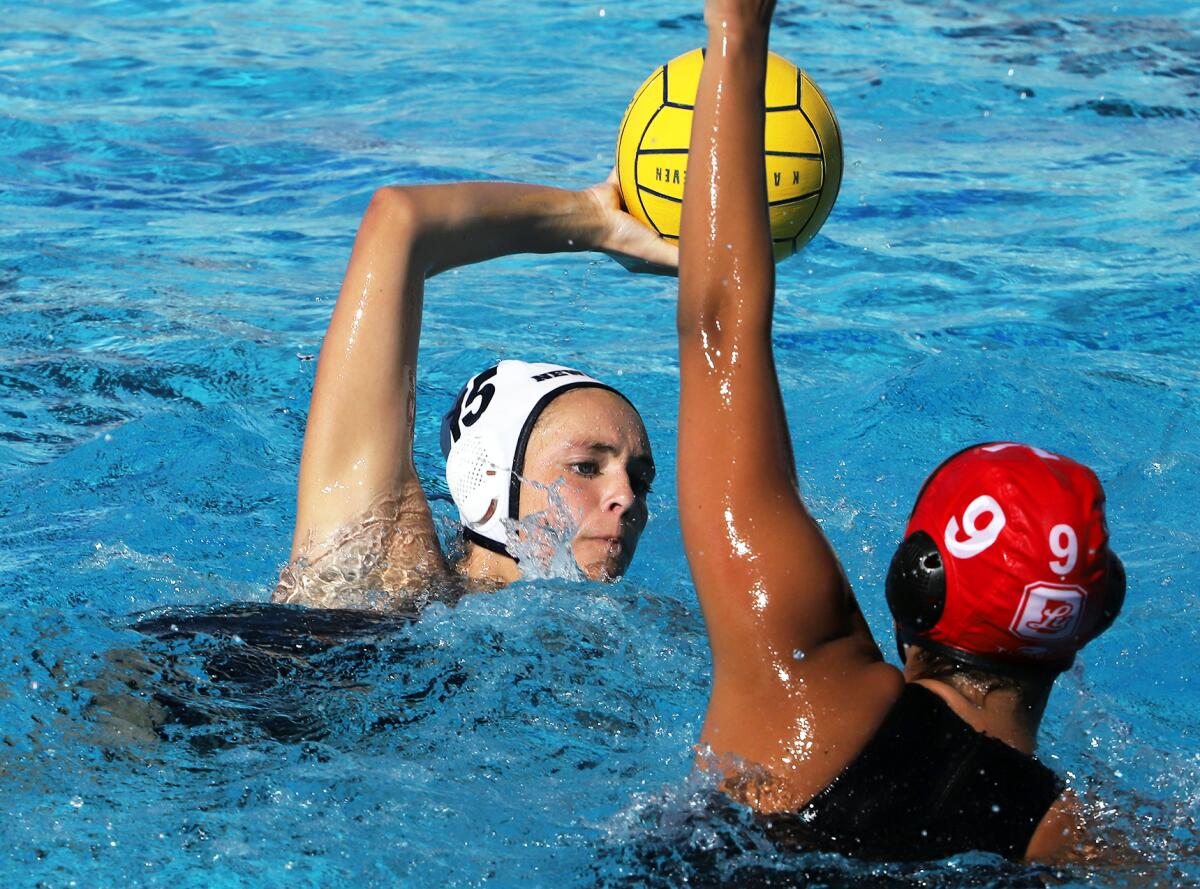 Newport Harbor's Kylie Robison (15) looks for an open player against Orange Lutheran during Saturday's action.