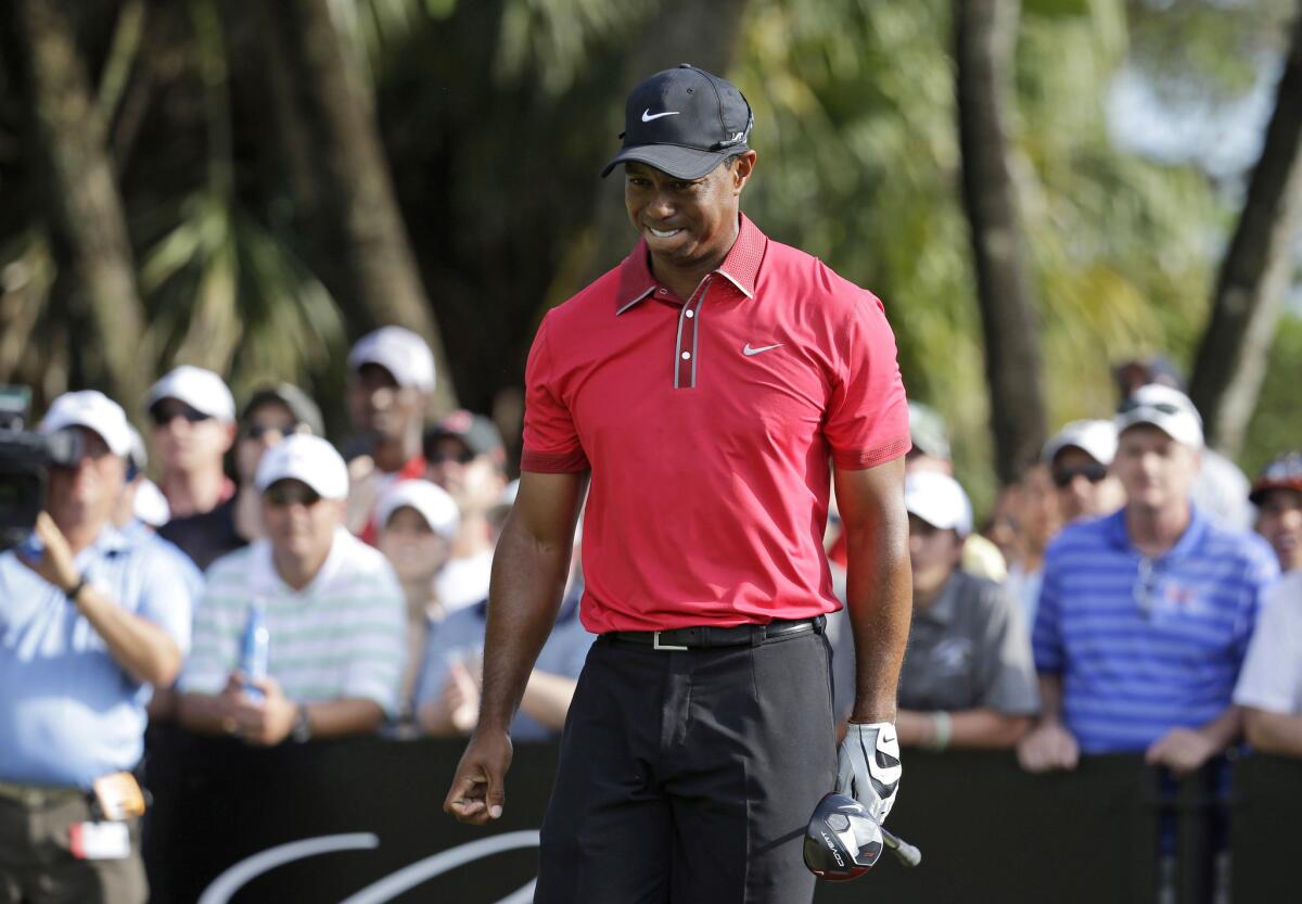 Tiger Woods, shown at the Cadillac Championship in March, is recovering from back surgery and is not expected to return to competitive play until summer.