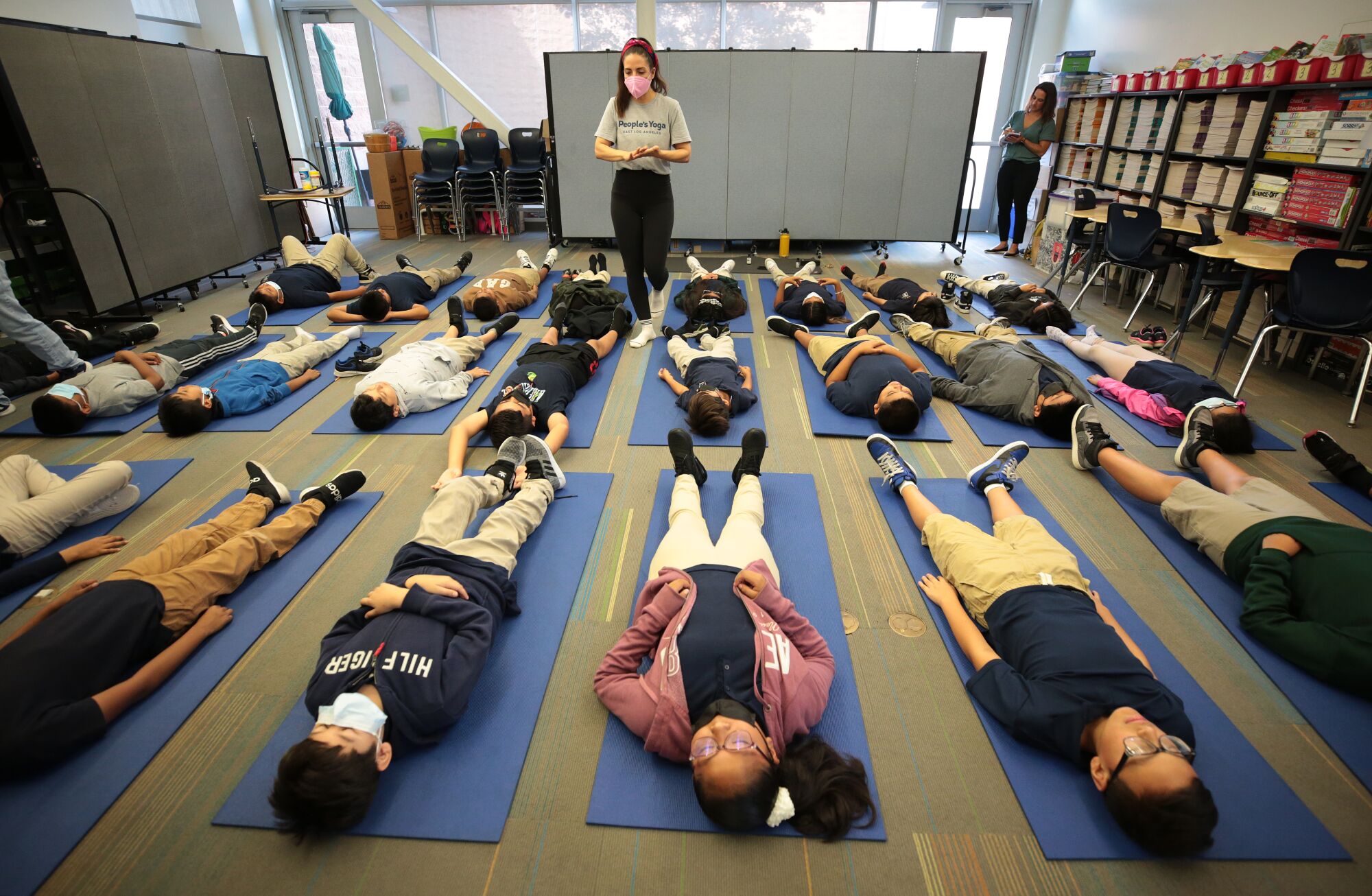 Leah Gallegos, co-founder of People Yoga, leads fifth grade at Accelerated Charter Elementary 